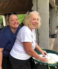 two women washing irises